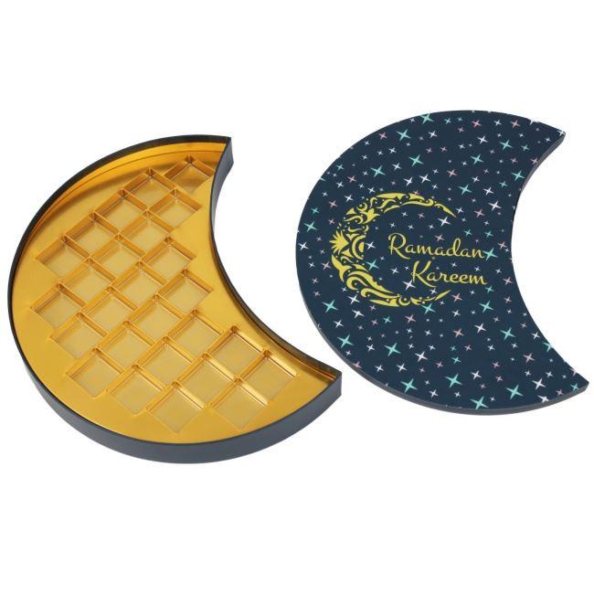 dunkelblaue Pralinenverpackung in Halbmondform